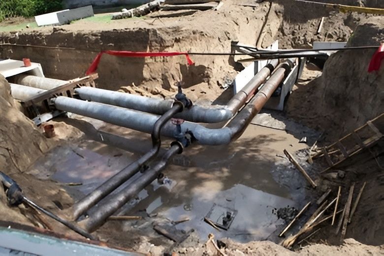 Workers Are Exposed, With Red Tape and Gray Pipes — David Lewis Solahart in Mullumbimby, NSW