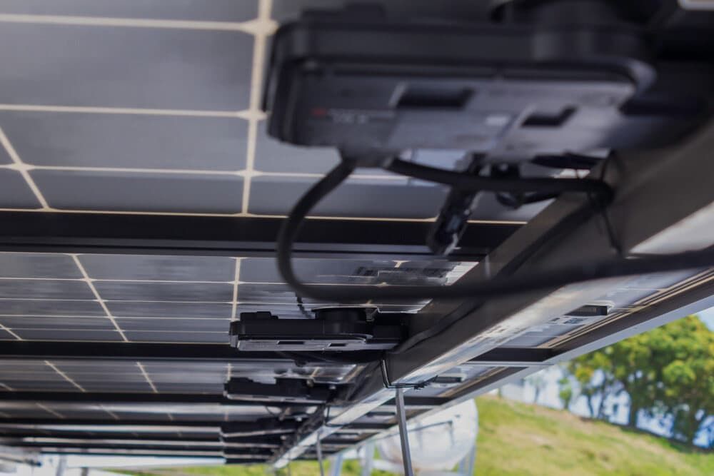 A Bunch Of Solar Panels Are Sitting On Top Of Each Other On A Roof — David Lewis Solahart in Murwillumbah, NSW