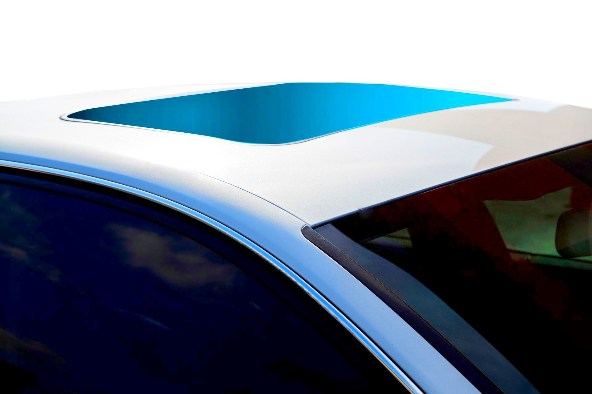 a white tesla model s is shown on a white background .