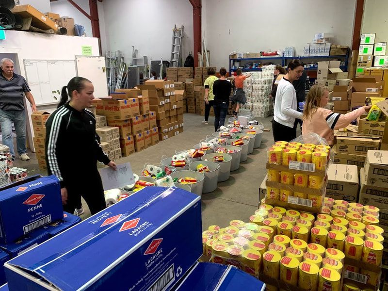 Boxes and People on the Warehouse — Wellington, NZ — Wasabi Group Limited