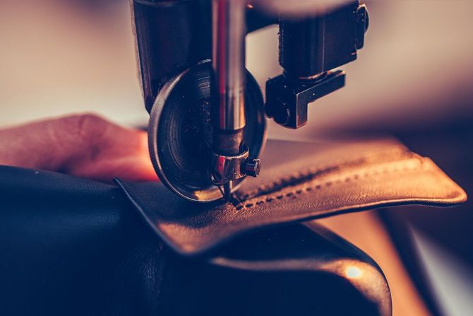 stitching the fine details of a boot