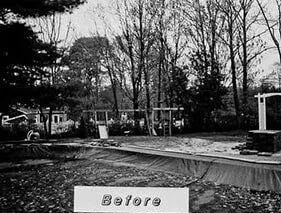 A black and white photo of a swimming pool under construction.