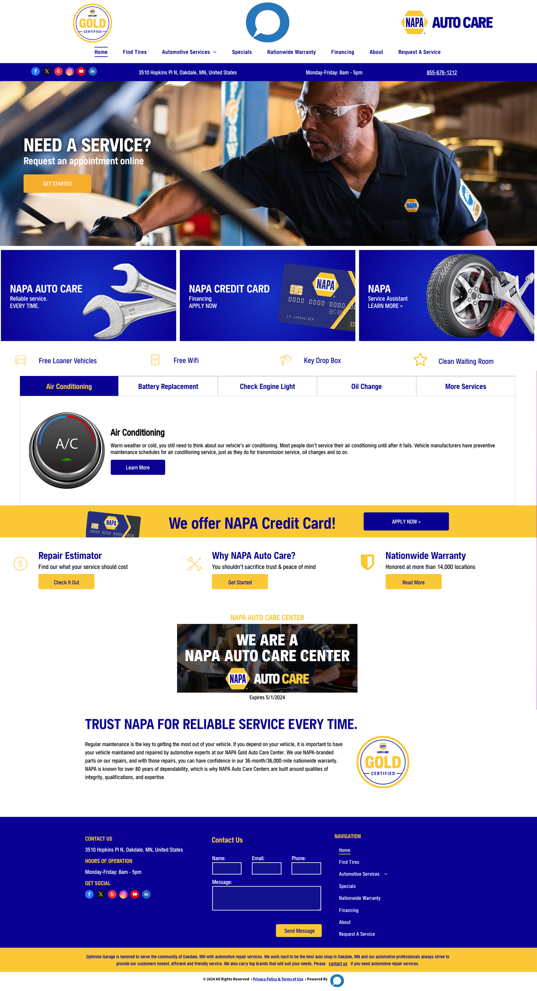 Website homepage for an auto repair shop featuring a mechanic working on a vehicle, service icons, and contact information.