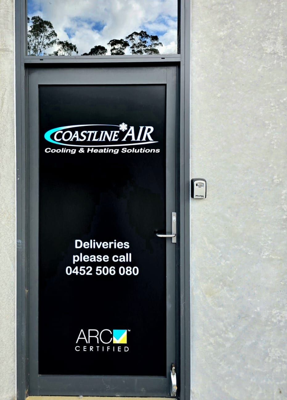 A door with coastline air written on it โ Coastline Air In Forresters Beach, NSW