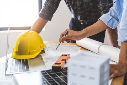 construction discussion over blueprint
