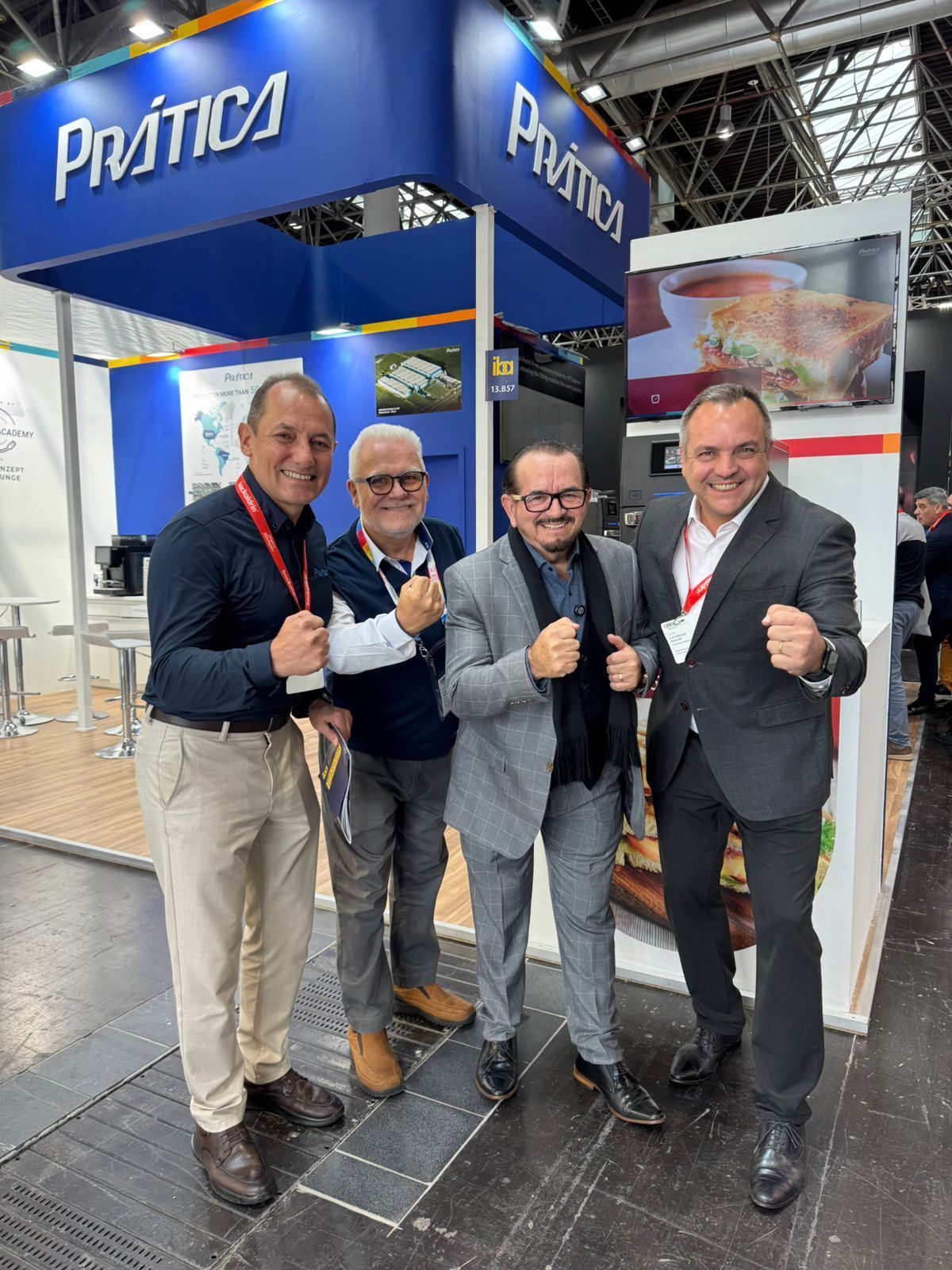 Four men posing in front of a