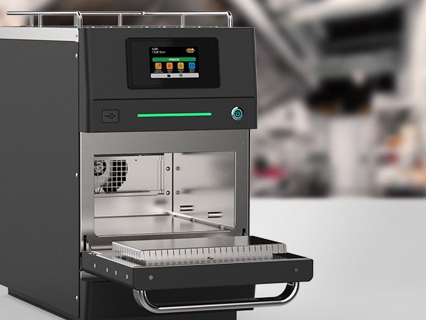 A machine with a screen on top of it