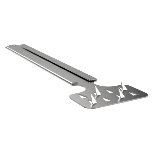 A close up of a metal object with nails on it on a white background.