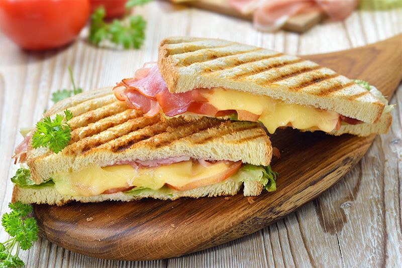 A close up of a breakfast sandwich on a plate.
