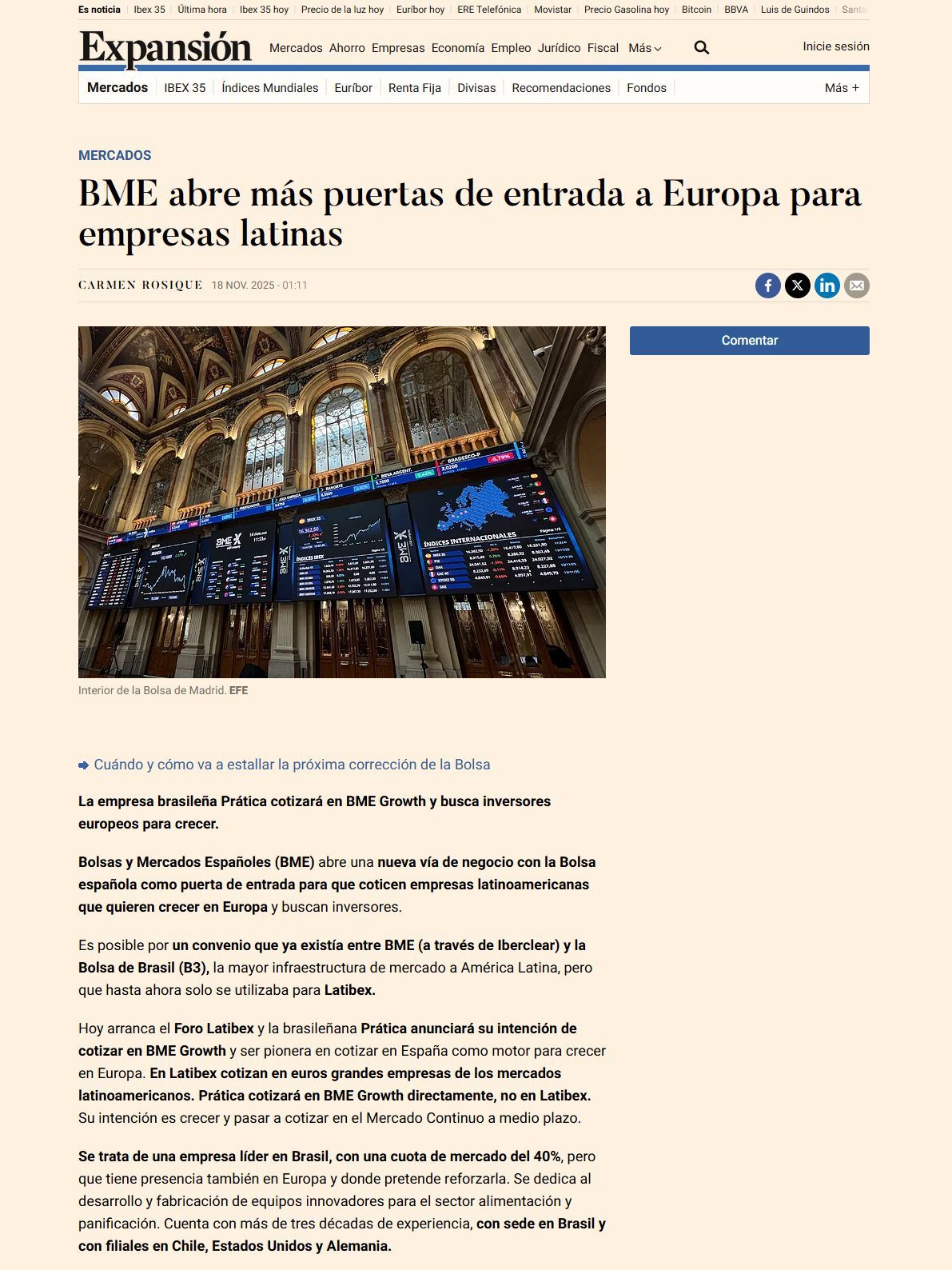 BME stock exchange hall with a large screen displaying European market data.