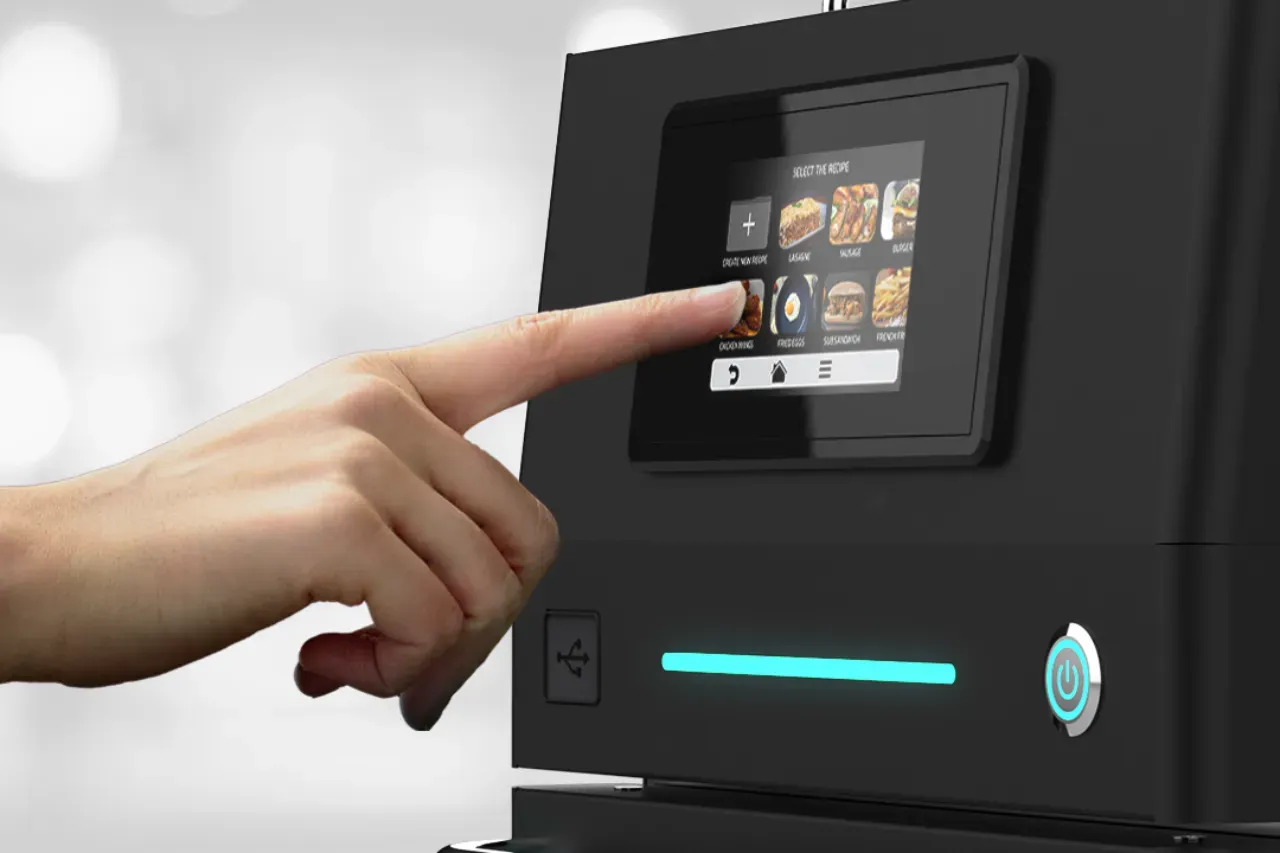 Hand with pointed finger operating Prática’s Fit Speed Oven touchscreen panel.