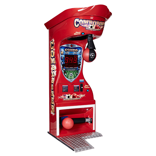 A jukebox is sitting on the floor in a room next to stairs.