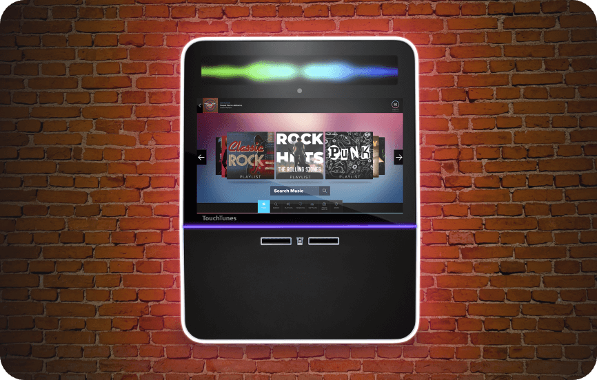 A close up of a jukebox with a rainbow design.