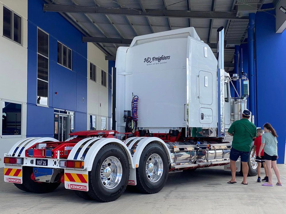 New Kenworth NQ Freighters Truck With Man And Two Kids — NQ Freighters In Townsville QLD