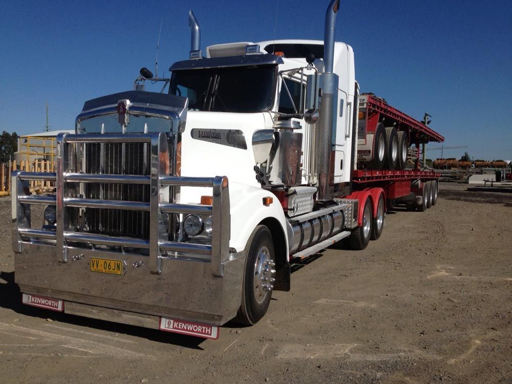 Red Trailer Carry On The White Big Truck — NQ Freighters In Bohle QLD