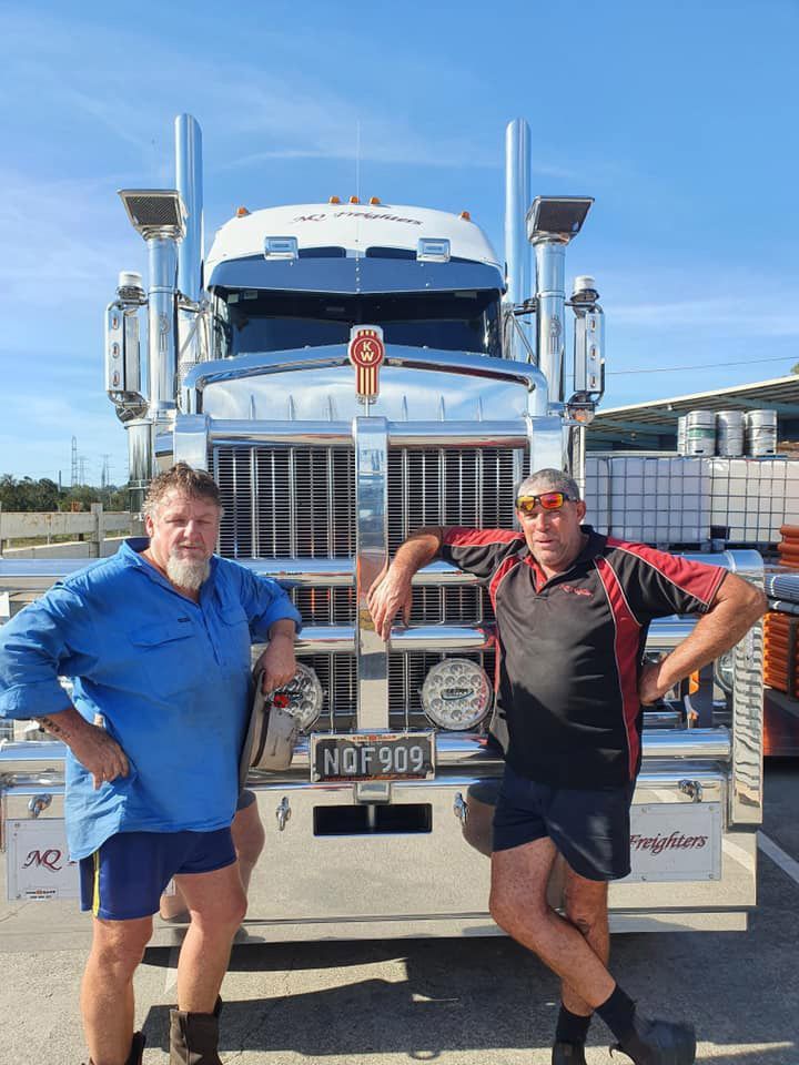 Two Men In The Front Of The Freight Truck — NQ Freighters In Bohle QLD