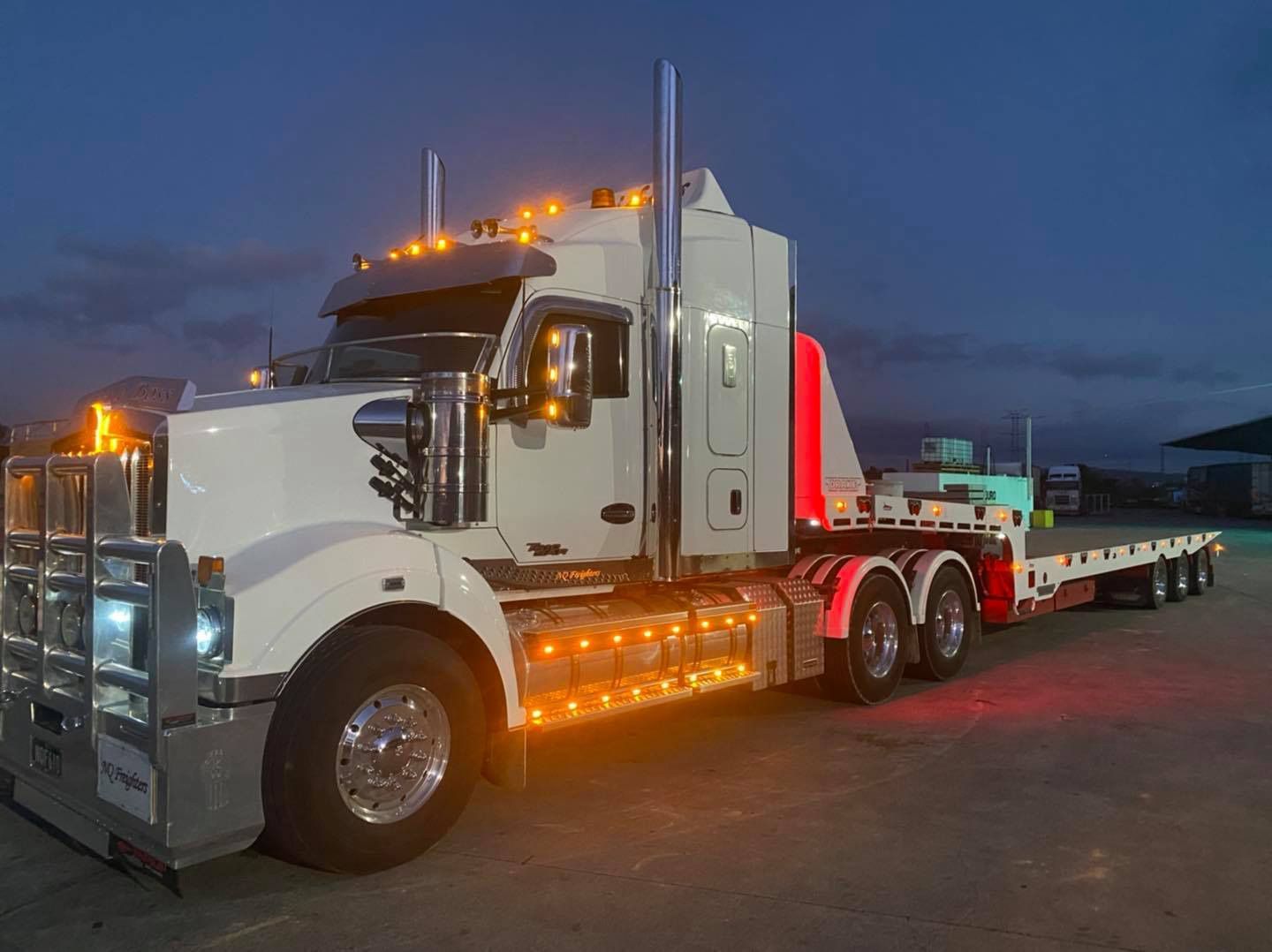 White Heavy Transport Truck At Night — NQ Freighters In Bohle QLD