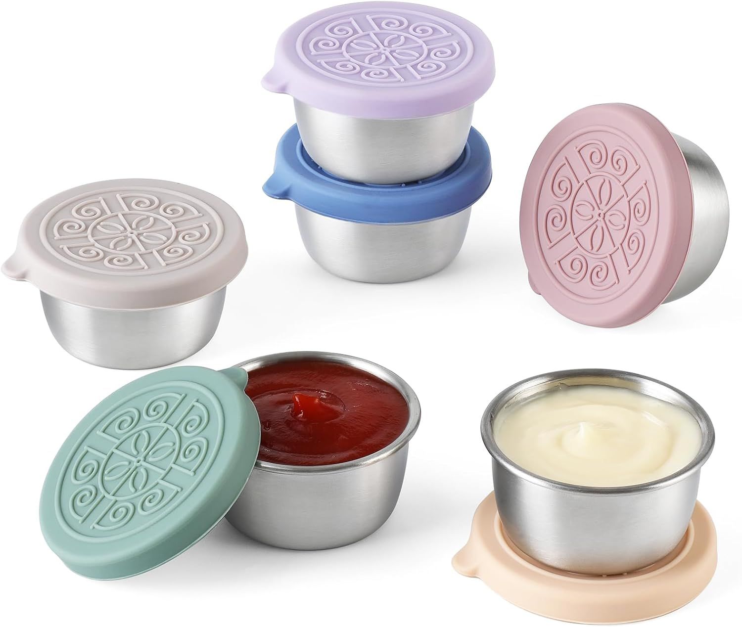 Six small metal tins of cream, each with pastel decorative lids, shown on a white background.