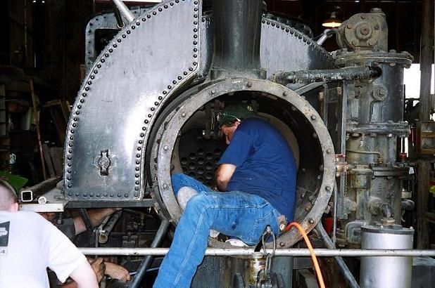 Holman Boiler employee Jason working in the boiler of L&W #1, a 1925 Baldwin steam locomotive, in 2007.