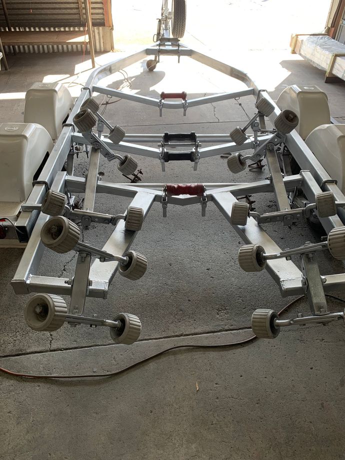 Metal framework with wheels in a workshop, viewed from the front on a concrete floor. — Jensen Welding & Fabrication in Chevallum, QLD