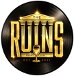 The Ruins Night Club logo in gold on a black vinyl record background