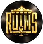 The Ruins Night Club logo in gold on a black vinyl record background