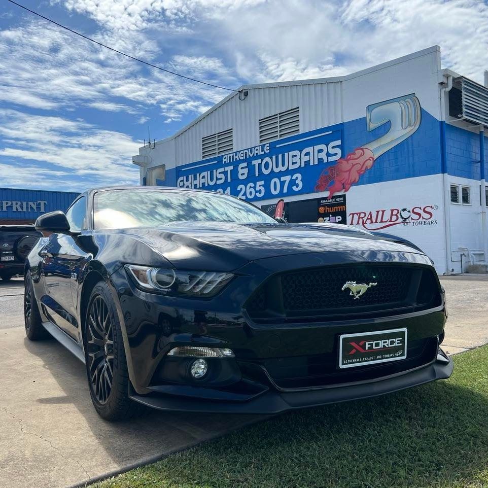 Black Ford Mustang in Front of an Exhaust — Aitkenvale Exhausts & Towbars Pty Ltd In Aitkenvale, QLD