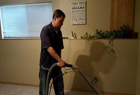 Carpet Cleaning — Man Cleaning Carpet in Rapid City, SD Carpet Cleaning — Man Cleaning Carpet in Rapid City, SD