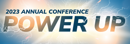 2023 Annual Conference banner with bold “Power Up” text over a blue sky and sunrise background