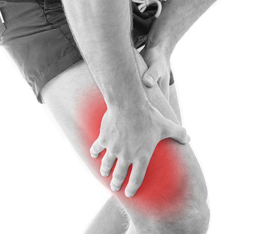 Athlete holding their thigh in pain after a muscle injury