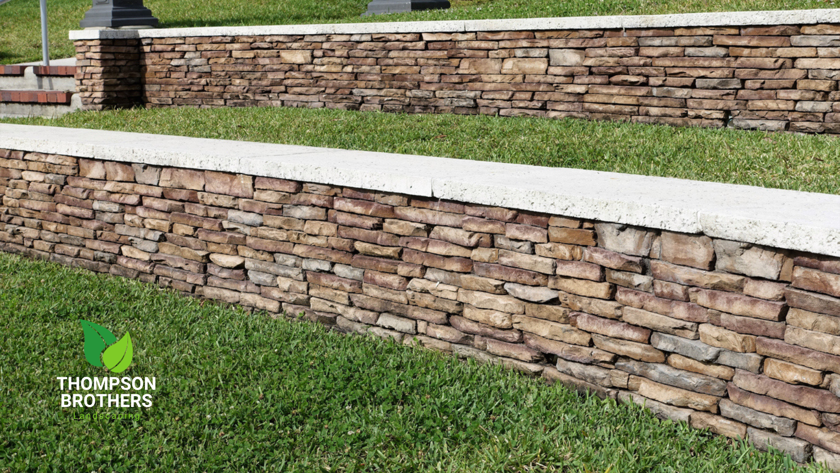 Stone retaining walls with grass tiers.