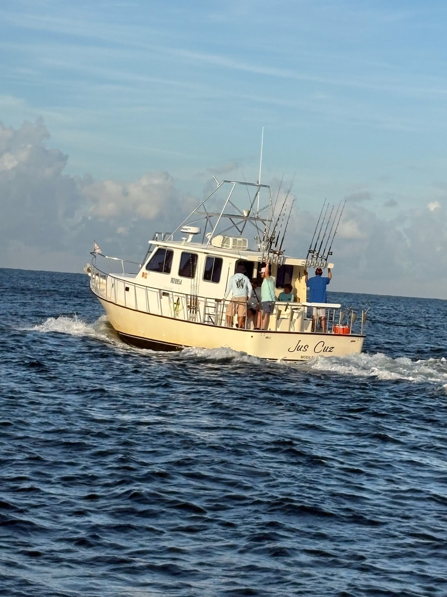 A large boat is floating on top of a large body of water.