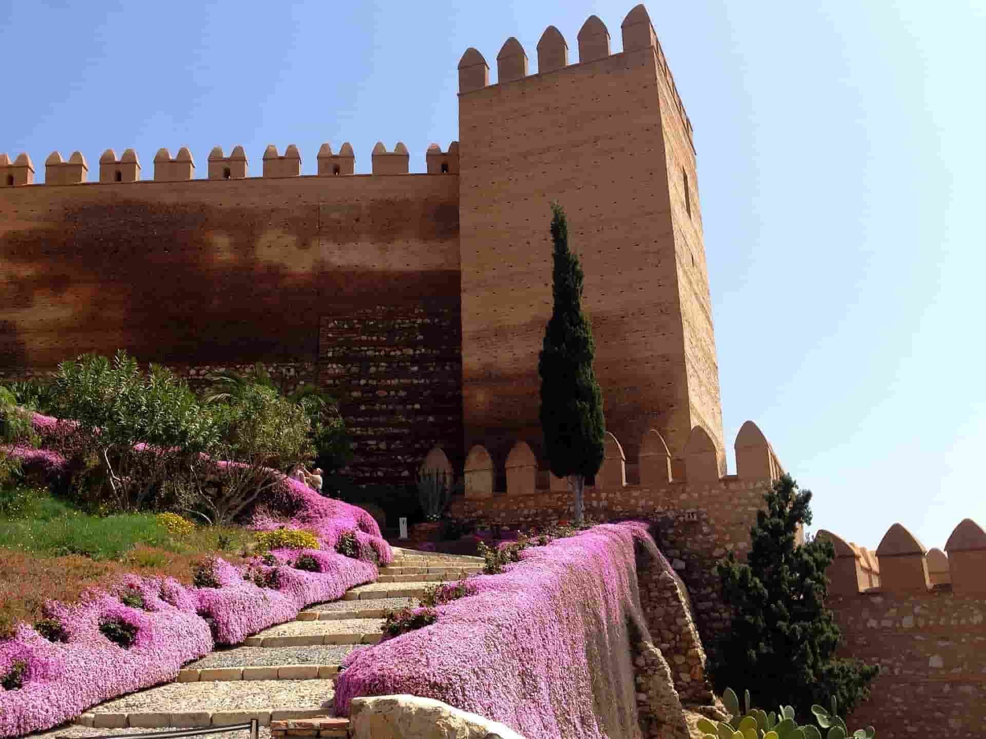 A castle on top of a hill in Almeria with stairs leading up to it