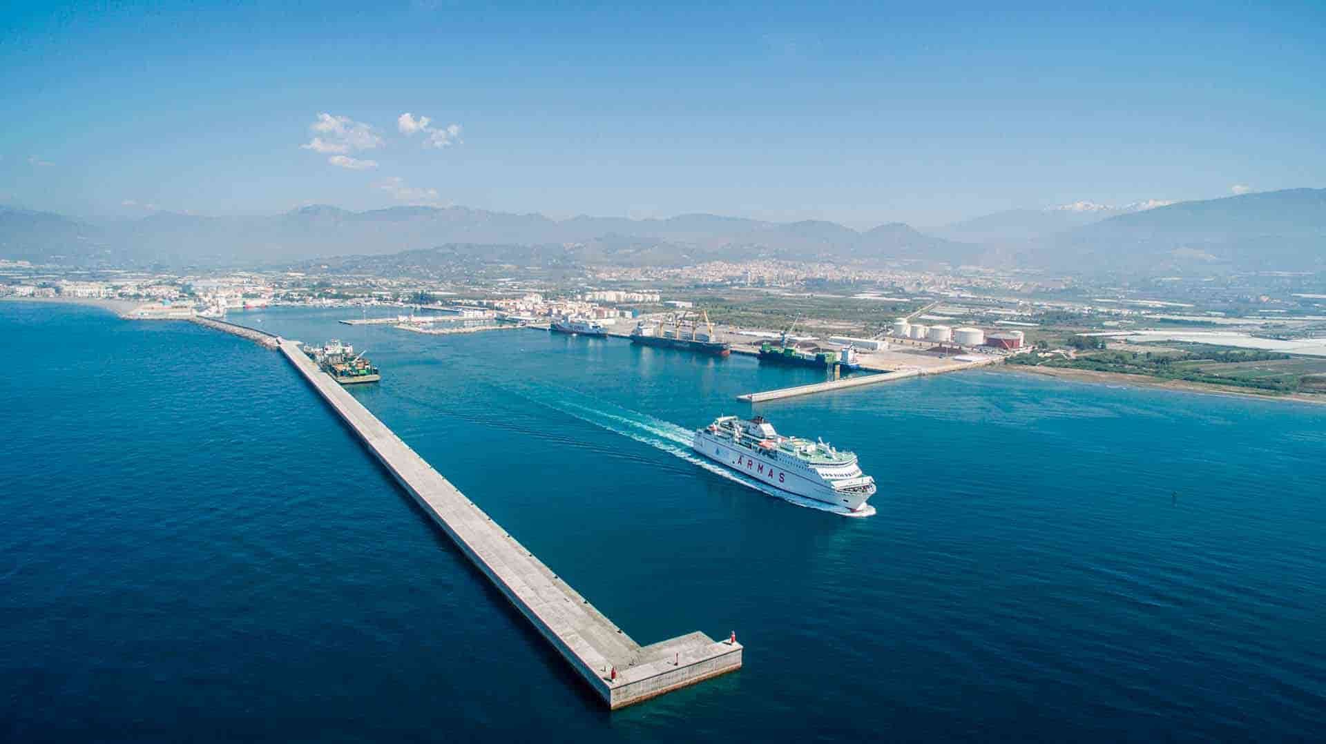An aerial view of a cruise ship docked at a pier in Motril.