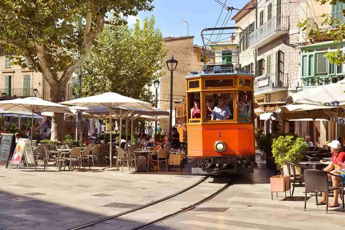 A trolley is going down the tracks in Soller.