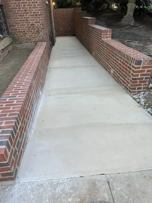 Premier masonry and concrete contractors install steel beams.