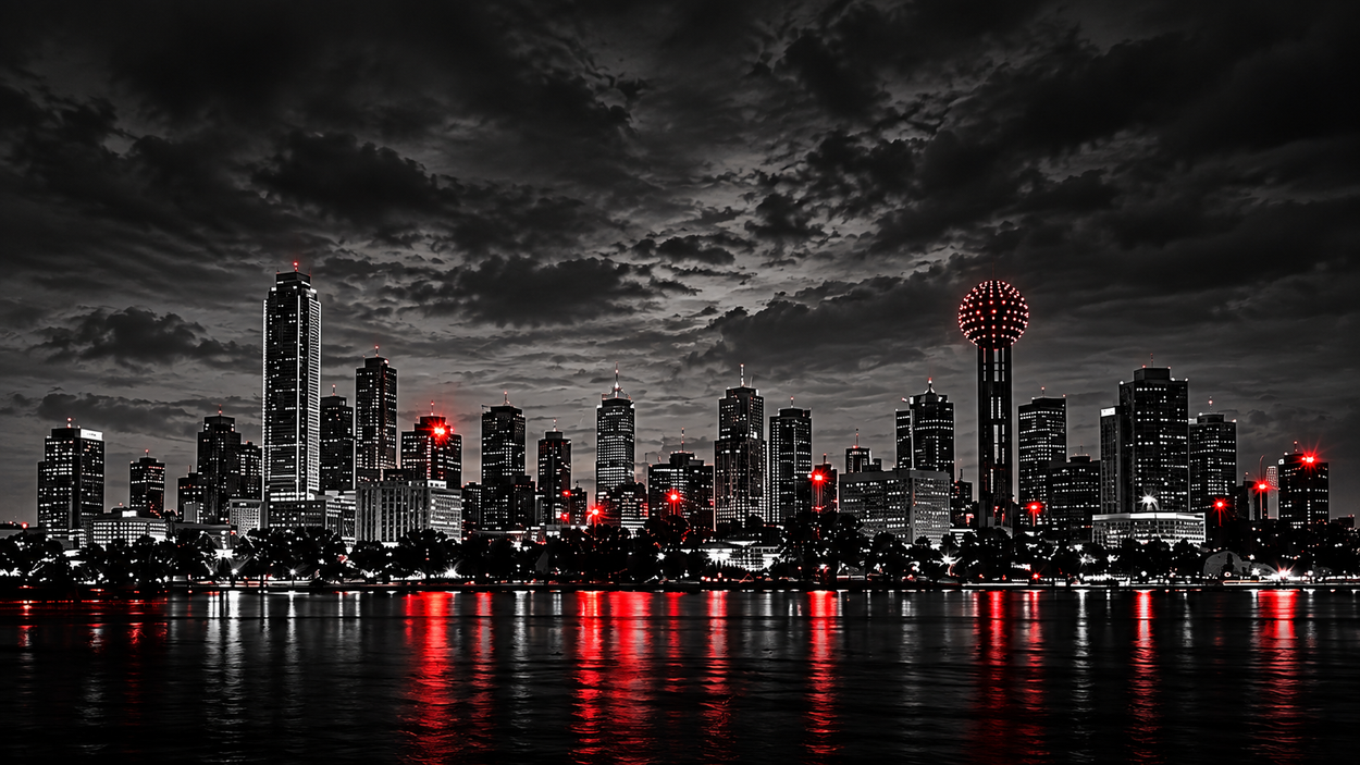 Nighttime city skyline with glowing red lights reflected on dark water under dramatic clouds