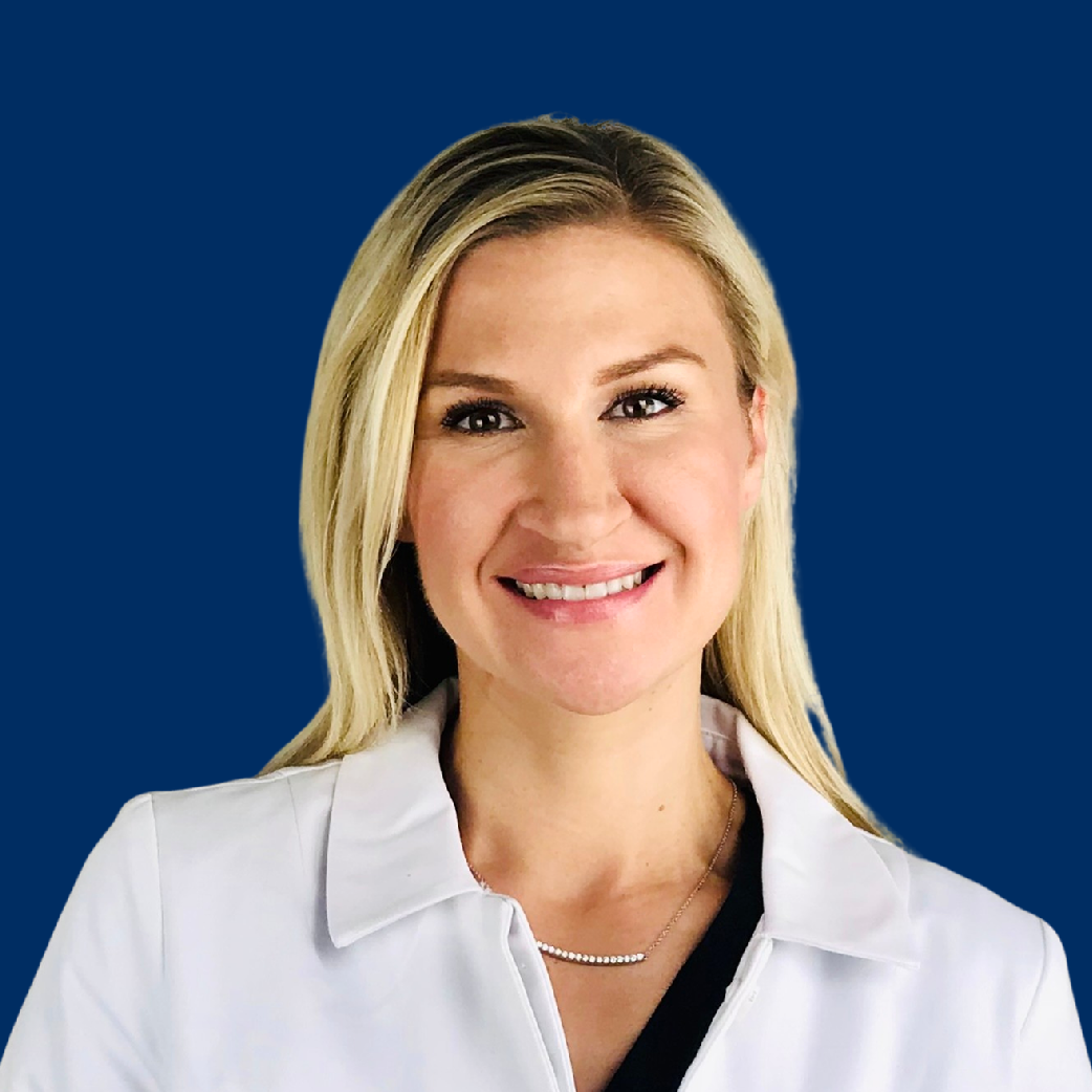 Smiling professional in a white coat against a blue background