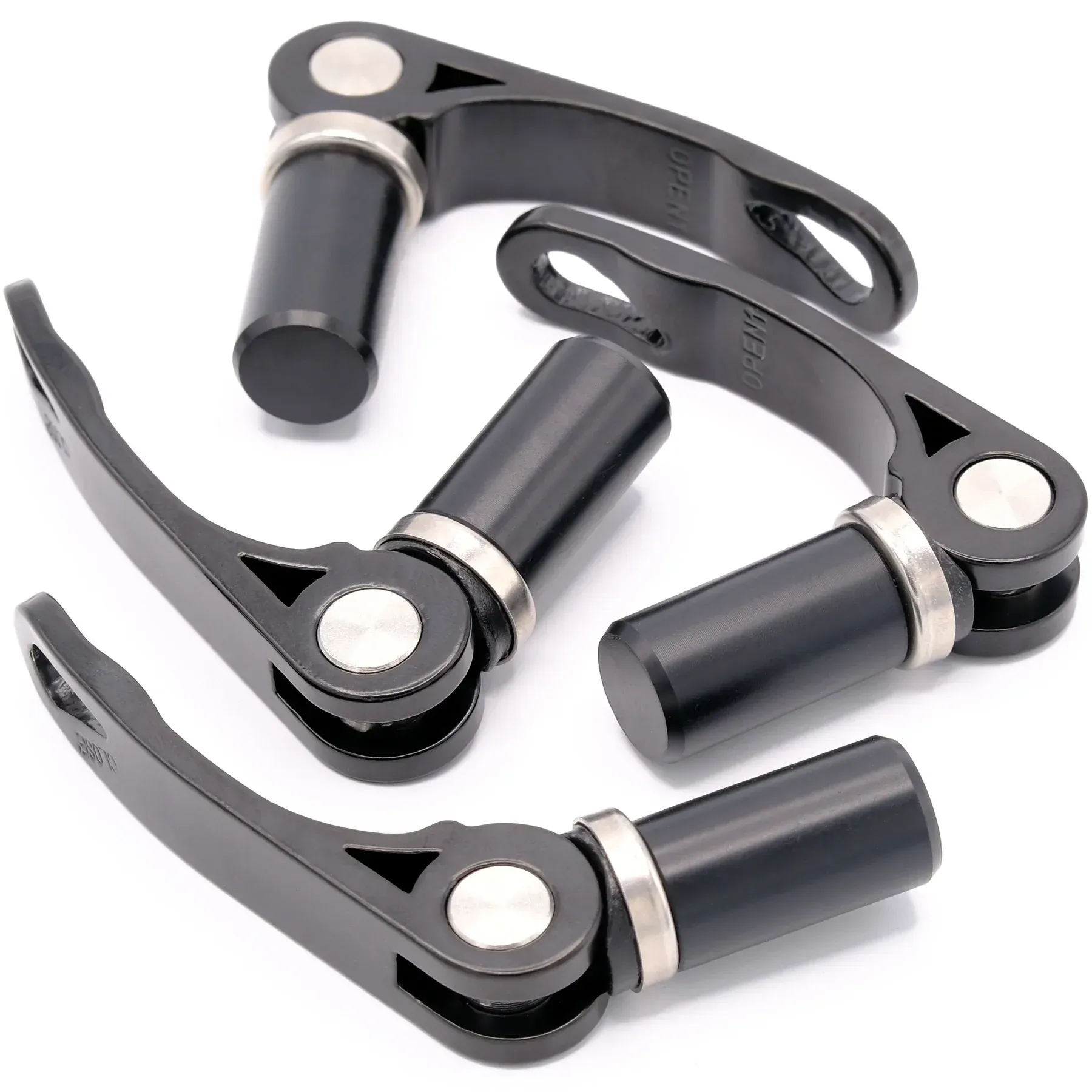 A bunch of black bicycle parts are stacked on top of each other