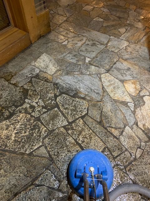 Blue Cleaning Gloves Holding A Sponge Cleaning A Tile Floor — Carson City, NV — Floor Masters Blue Cleaning Gloves Holding A Sponge Cleaning A Tile Floor — Carson City, NV — Floor Masters