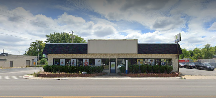 A building with a sign that says child care Toledo OH