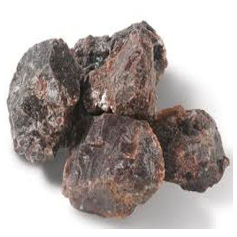 Three dark, rough rocks with reddish-brown patches on a white background