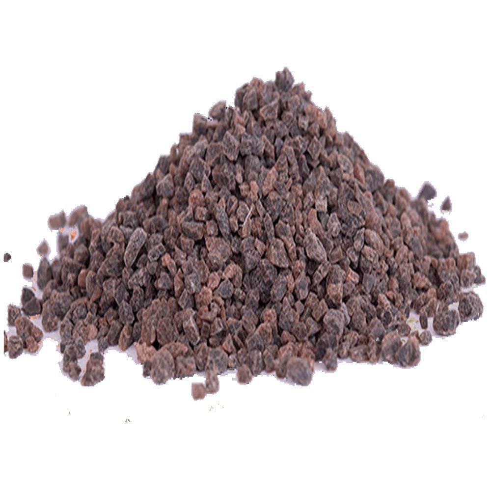 Pile of dark brown crushed rock or gravel on a white background