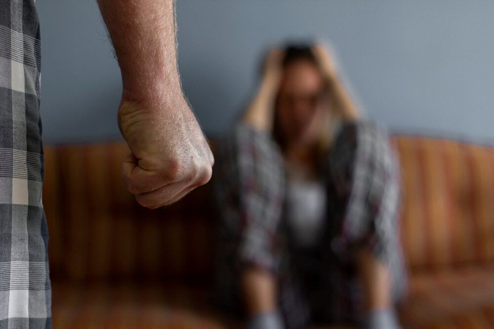 A Man With A Closed Fist And A Scared Woman — Spencer Lawyers In Gosford, NSW