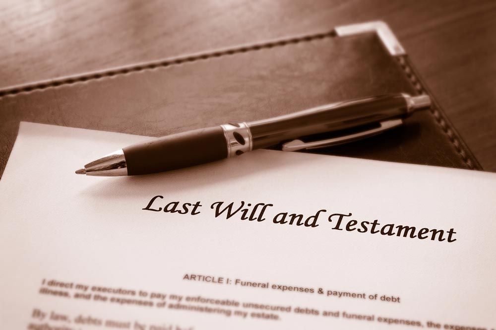 A Copy Of Last Will And Testament With A Pen On A Table