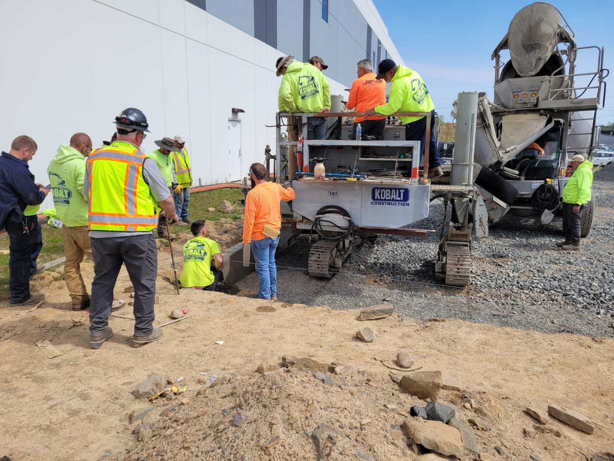A group of construction workers are working on a construction site.