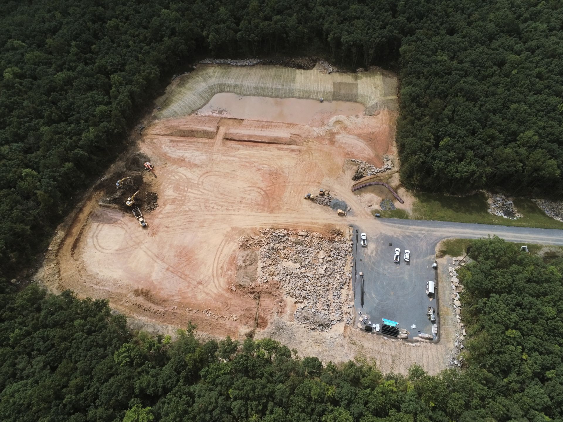 An aerial view of a Kobalt construction site in the middle of a forest.