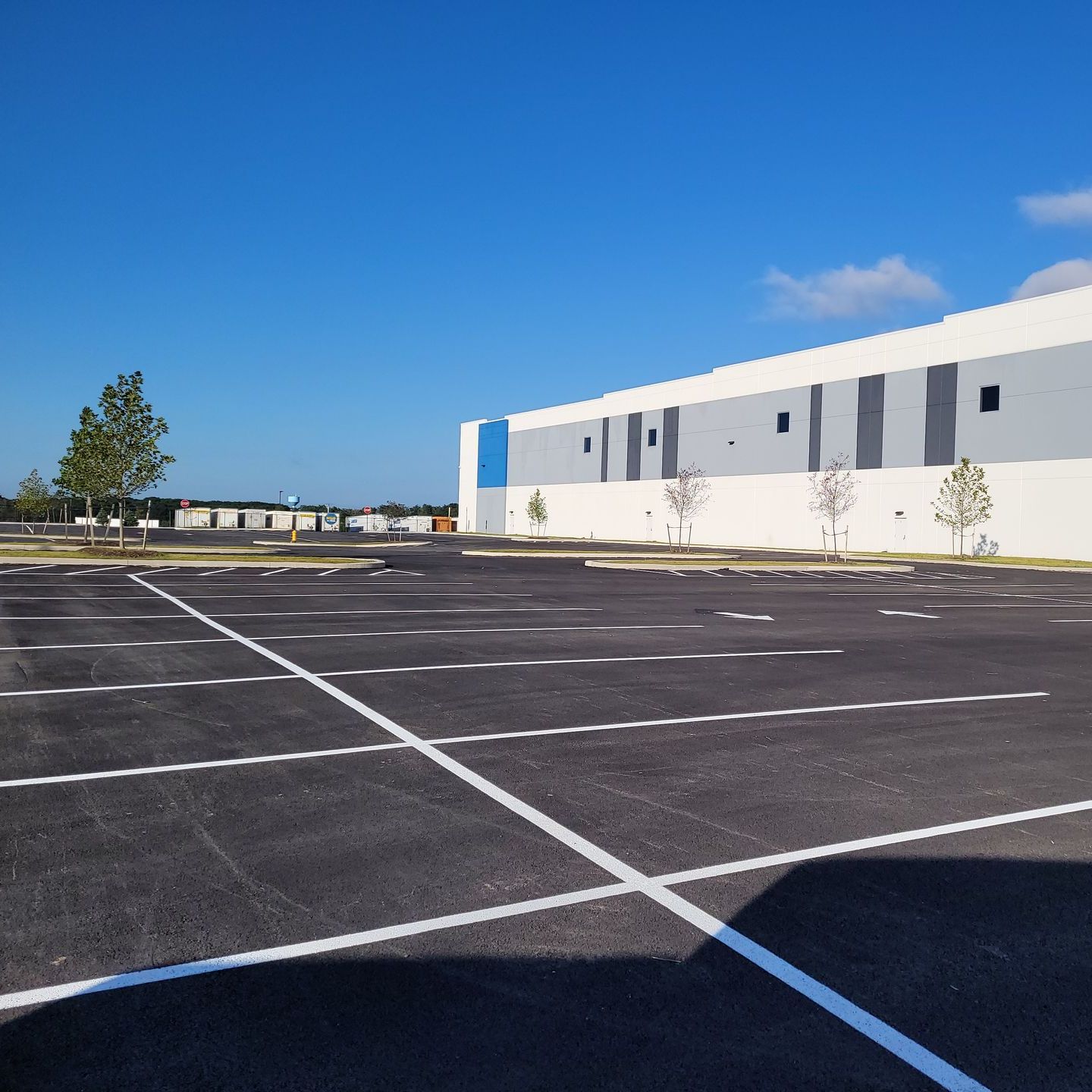 A large building with a parking lot in front of it