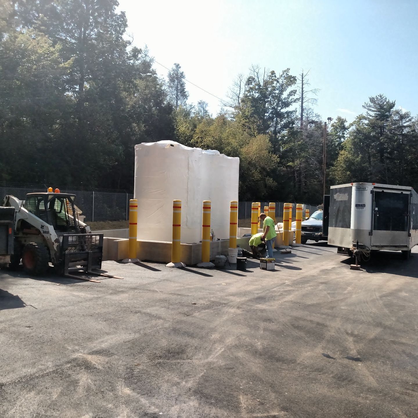 A white truck is parked in a parking lot