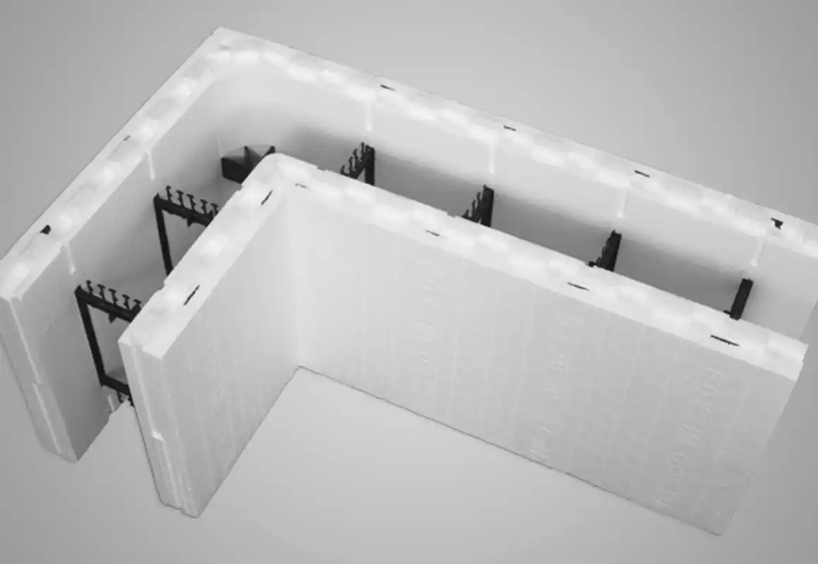 A white foam block is sitting on a gray surface. A white foam block is sitting on a gray surface.